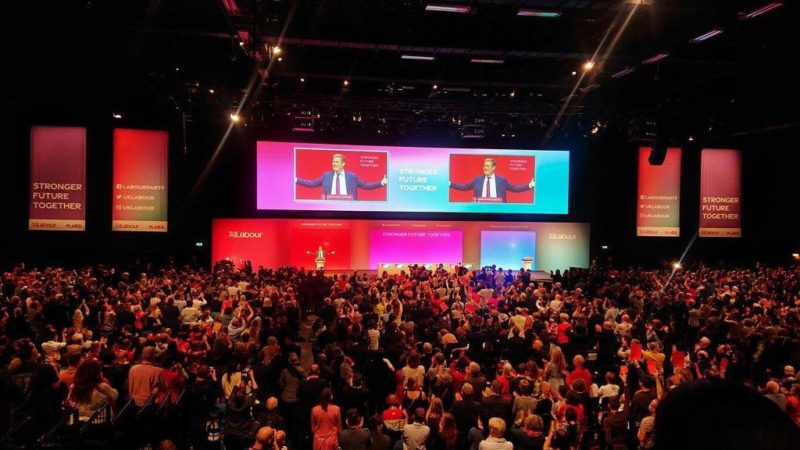 Keir Starmer, with his hands stretched out, speaking at the Labour Party Conference 2021 