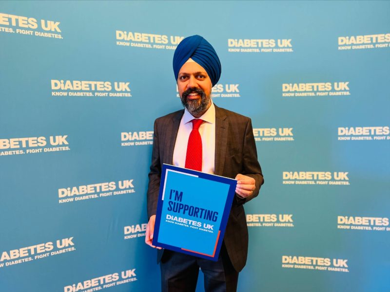 Tan Dhesi holding a Diabetes UK sign