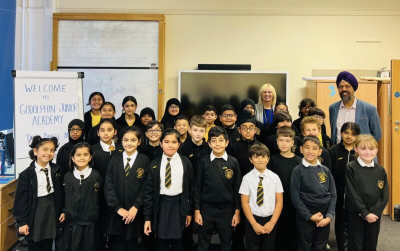 Tan Dhesi with students from Godolphin Junior Academy.