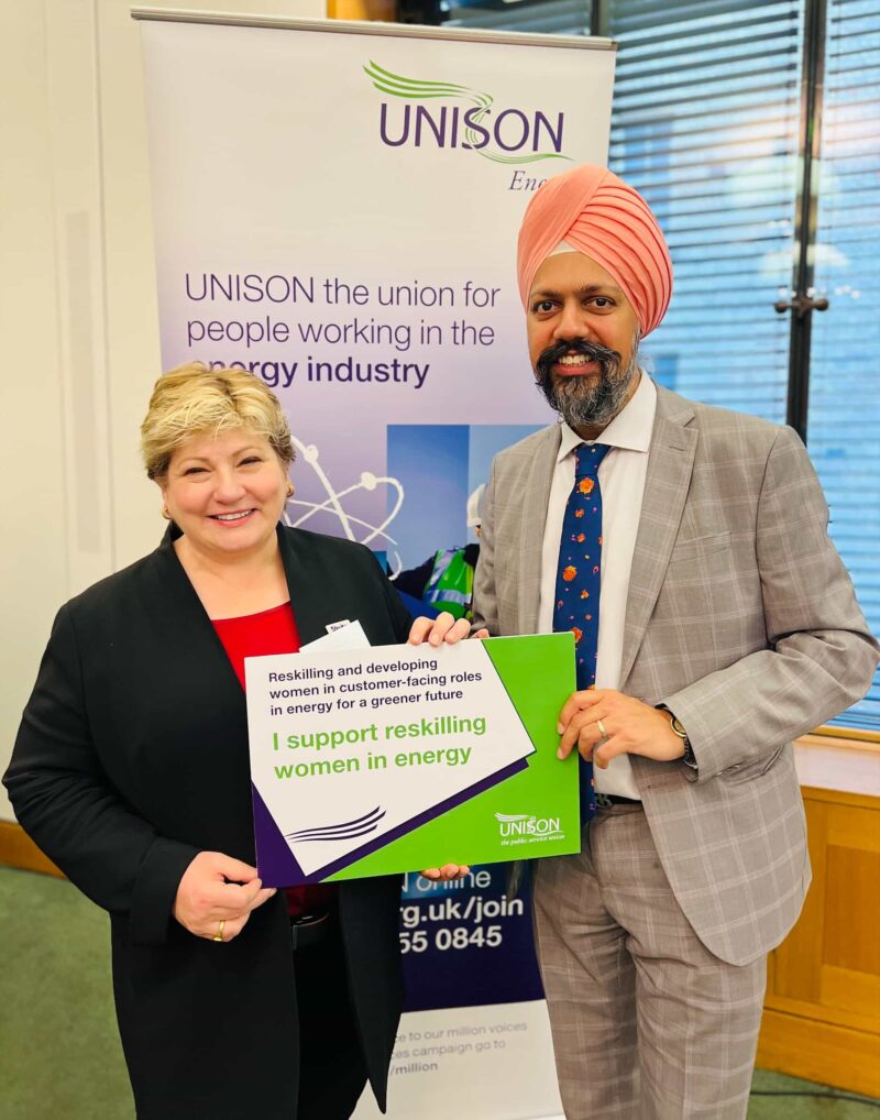 Tan Dhesi with Emily Thornberry MP holding a sign which reads: "I support reskilling women in energy".