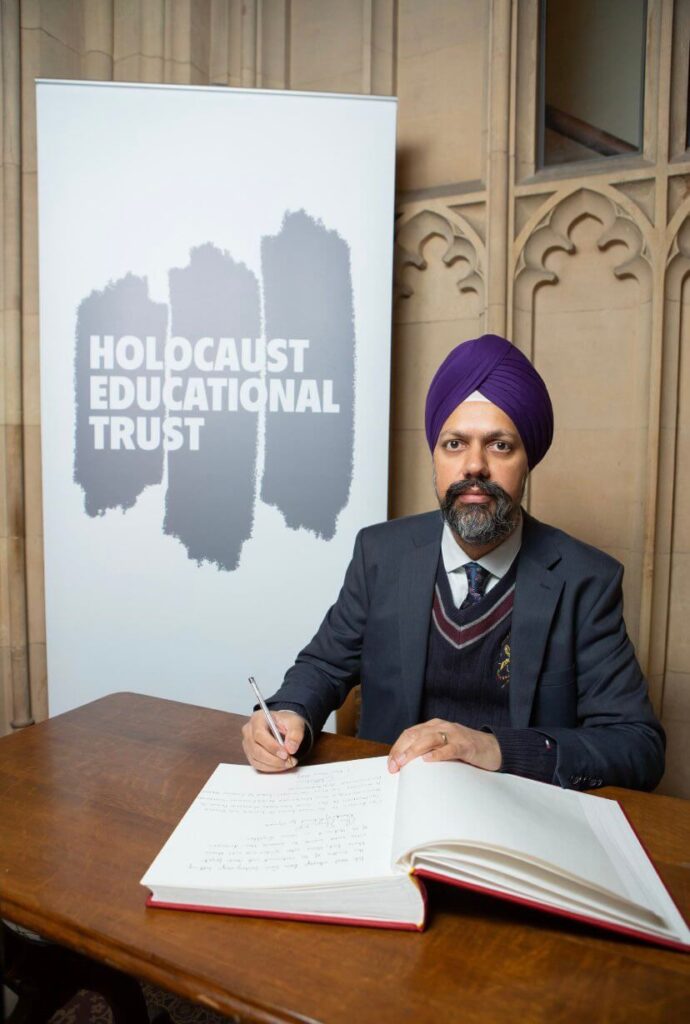 Tan Dhesi MP signing the Holocaust Educational Trust's Book of Commitment.