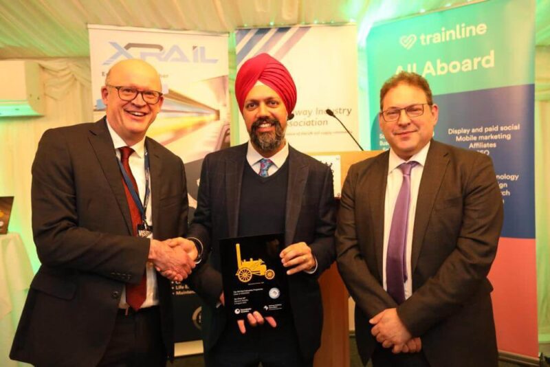 Tan Dhesi MP receiving an award from the Railway Industry Association.