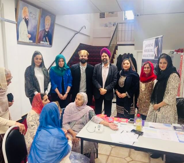 Tan Dhesi MP pictured with 13 Community Clinic.